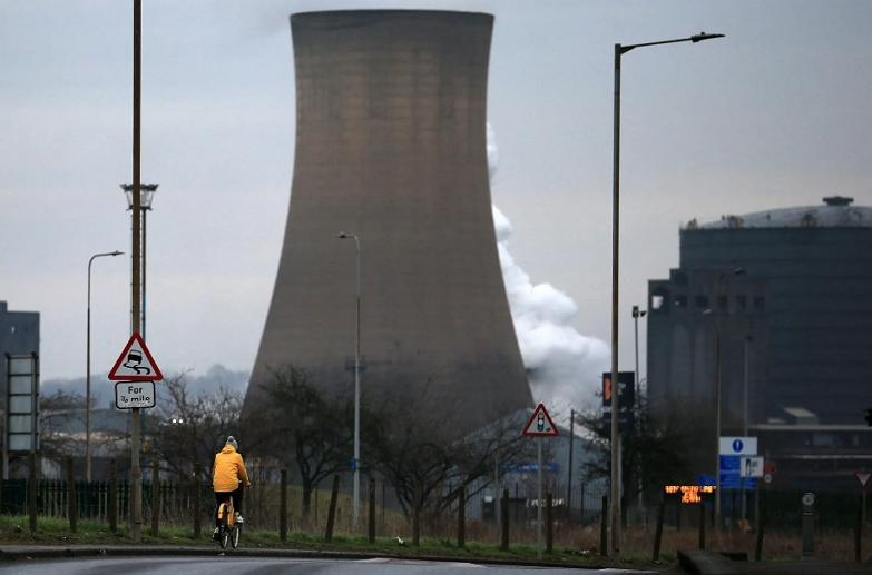 A cyclist rides near British Steel's Scunthorpe factory in North Lincolnshire